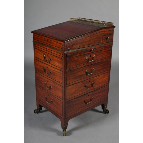 481 - A LATE REGENCY MAHOGANY AND EBONY LINE INLAID DAVENPORT, having a brass Greek key gallery and red le... 