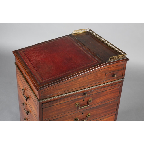 481 - A LATE REGENCY MAHOGANY AND EBONY LINE INLAID DAVENPORT, having a brass Greek key gallery and red le... 