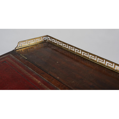 481 - A LATE REGENCY MAHOGANY AND EBONY LINE INLAID DAVENPORT, having a brass Greek key gallery and red le... 