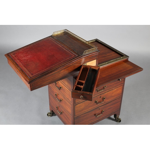 481 - A LATE REGENCY MAHOGANY AND EBONY LINE INLAID DAVENPORT, having a brass Greek key gallery and red le... 