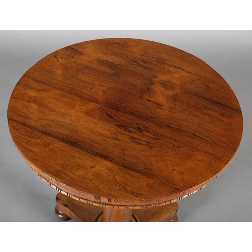 482 - A LATE REGENCY ROSEWOOD PEDESTAL TABLE, circular, on a tapered column and tripartite platform base w... 