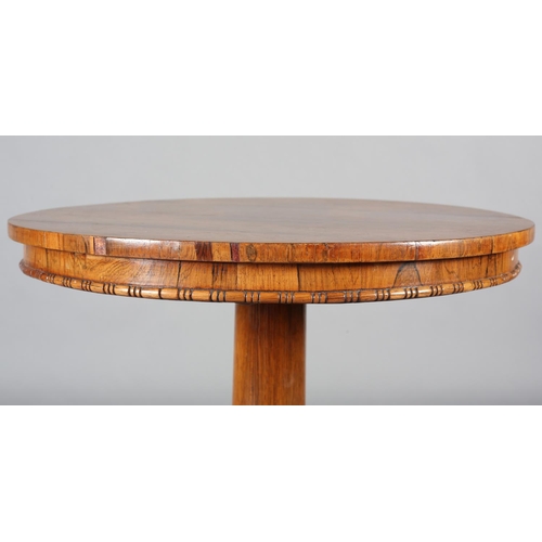 482 - A LATE REGENCY ROSEWOOD PEDESTAL TABLE, circular, on a tapered column and tripartite platform base w... 