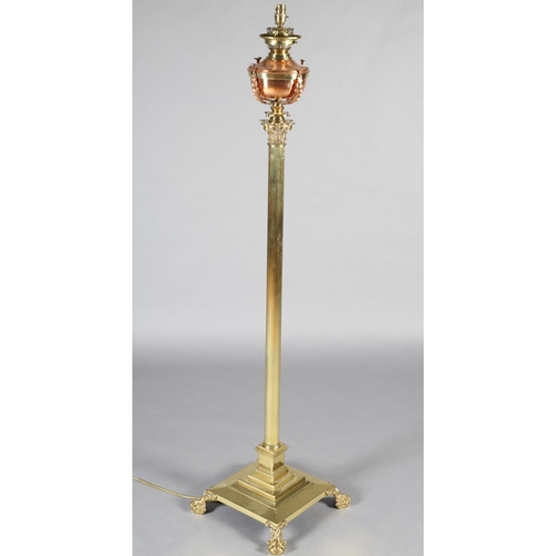 173 - A LATE 19TH/EARLY 20TH CENTURY BRASS STANDARD OIL LAMP, converted to electricity, having a copper re... 