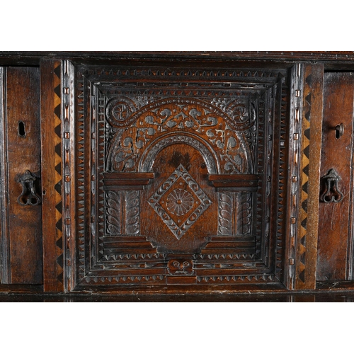 486 - AN OAK COURT CUPBOARD, 17th century and later, having an arcaded frieze above a canopied central pan... 