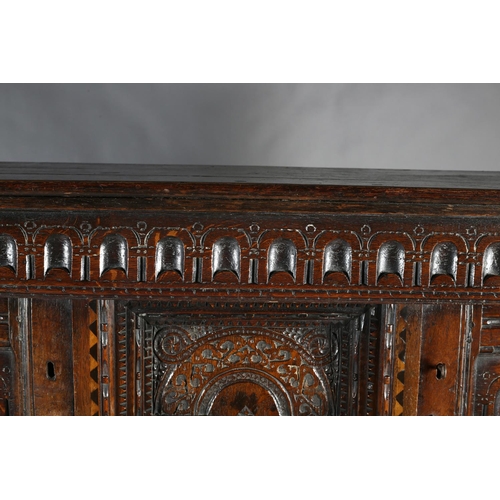 486 - AN OAK COURT CUPBOARD, 17th century and later, having an arcaded frieze above a canopied central pan... 