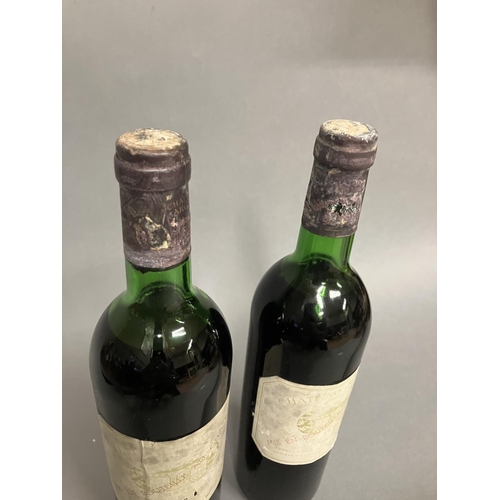 58 - CHATEAU MARGAUX 1ER GRAND CRU CLASSE 1976 2 Bottles 75cl  Levels top shoulder. Labels faded and caps... 