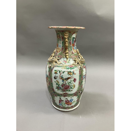 10 - A Canton Chinese porcelain vase, with applied Dogs of Foo to the neck, the shoulders moulded with dr... 