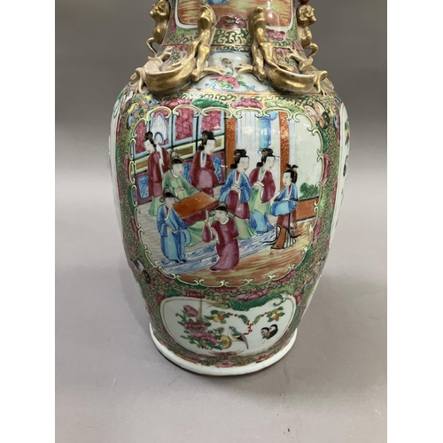 10 - A Canton Chinese porcelain vase, with applied Dogs of Foo to the neck, the shoulders moulded with dr... 