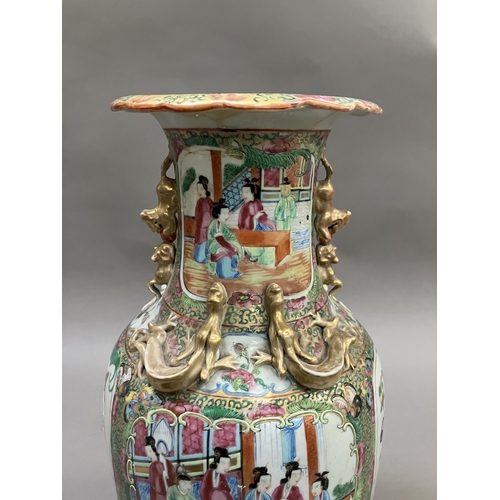 10 - A Canton Chinese porcelain vase, with applied Dogs of Foo to the neck, the shoulders moulded with dr... 