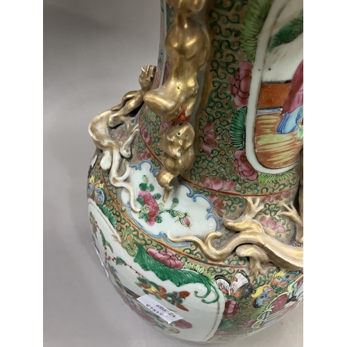 10 - A Canton Chinese porcelain vase, with applied Dogs of Foo to the neck, the shoulders moulded with dr... 