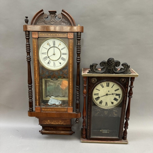 252 - A late 19th century German wall strike clock in an inlaid and veneered case, twin train spring movem... 