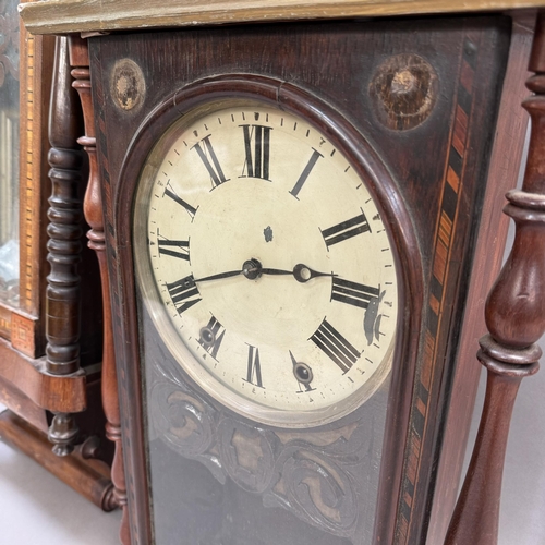 252 - A late 19th century German wall strike clock in an inlaid and veneered case, twin train spring movem... 