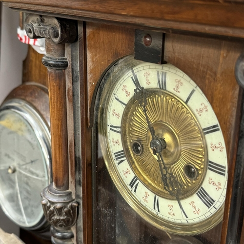 156 - A small collection of late 19th and early 20th clocks and barometer including a German wall strike c... 