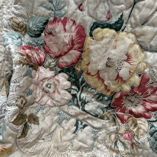 150 - A pair of 20th century quilted curtains, printed with decorative birds and flowers on a cream ground... 