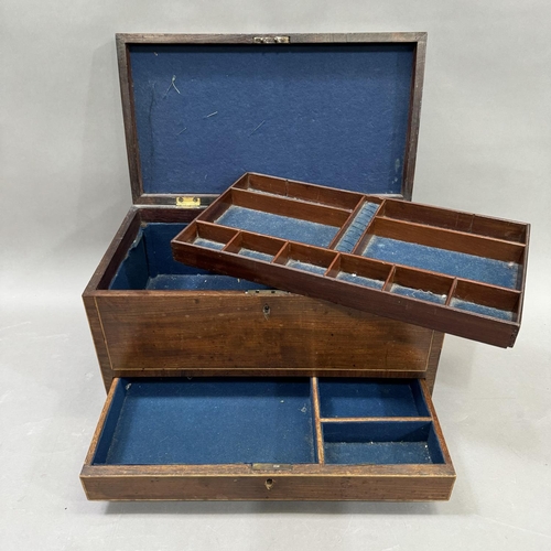 182 - A mahogany sewing workbox with satinwood inlay, on ball feet, having a fitted interior 45.5cm x 26cm