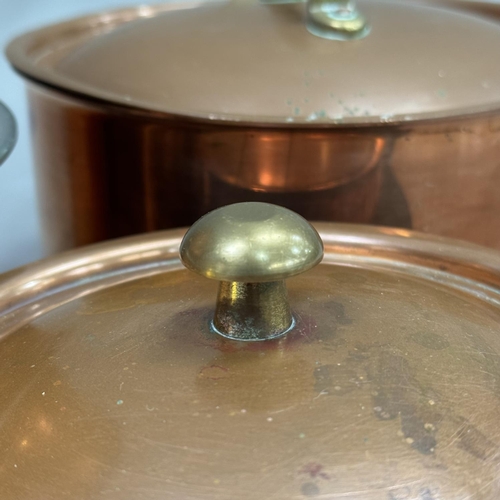 174 - A collection of three Tagus copper saucepans and lids of graduated size together with a frying pan a... 