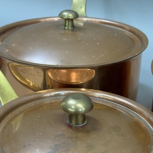 174 - A collection of three Tagus copper saucepans and lids of graduated size together with a frying pan a... 