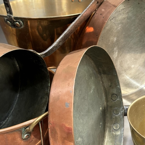 176 - A large copper saucepan, another smaller stamped Lowther and another, a copper fish kettle and two j... 