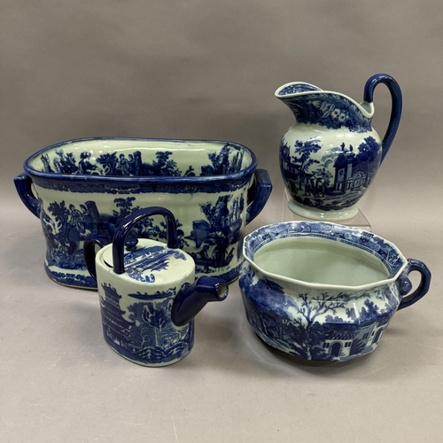 183 - A blue and white ceramic twin handled foot bath, a large jug, a teapot formed as a watering can and ... 