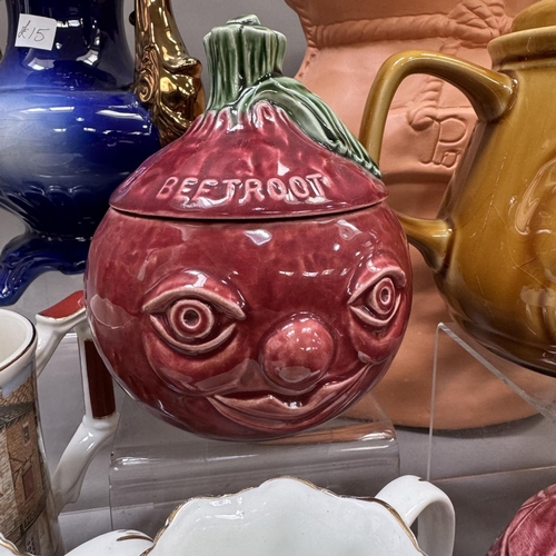 41 - A collection of Sylvac preserve pots, moulded teapots and a composite potato sack