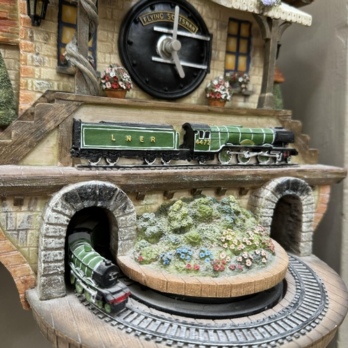 268 - A 'Memories of Steam' Flying Scotsman commemorative cuckoo clock, 31cm high