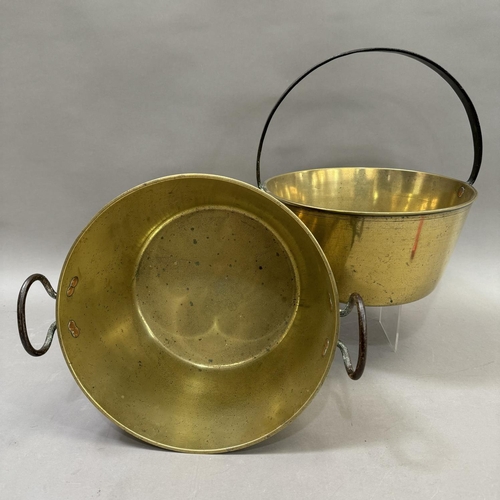 236 - Two brass jam pans, one with a swing handle and one twin handled