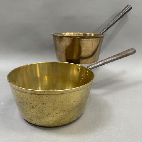 235 - Two brass saucepans with iron handles