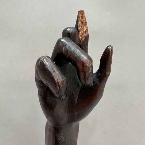 7 - A fruitwood carving of an arm with out stretched finger, possible ecclesiastical, 36.cm