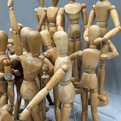 157 - 19 wooden artist mannequins on stands, some at fault