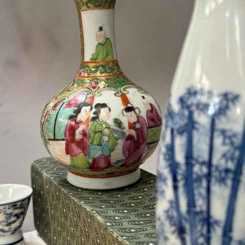 20 - A Chinese famille rose bottle neck vase, enamelled with figures and insects, a Japanese sake ewer wi... 