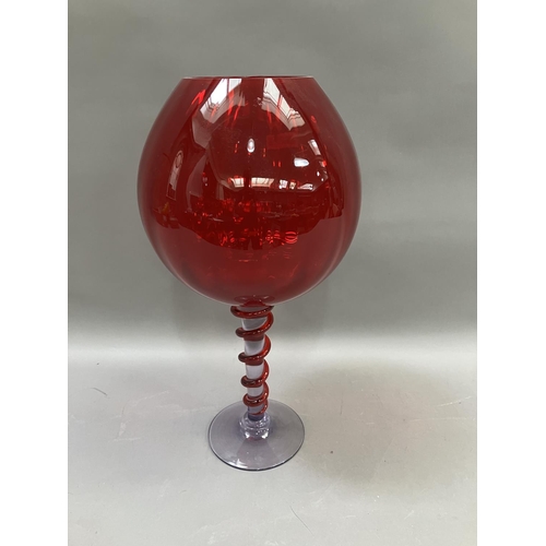 230 - A large Murano goblet having a red bowl, the stem with applied red glass, 47m high