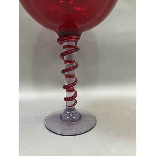 230 - A large Murano goblet having a red bowl, the stem with applied red glass, 47m high