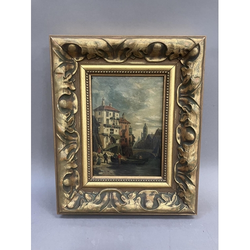 289 - A continental scene of a canal through a town, oil on panel in moulded gilt frame 16cm x 11cm