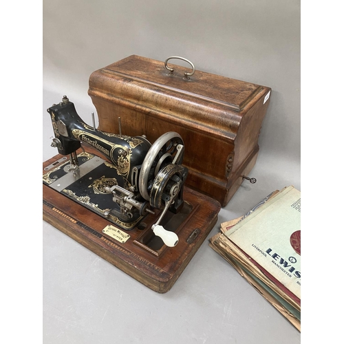 43 - A Frister and Rossman sewing machine 1377226, in oak carrying case