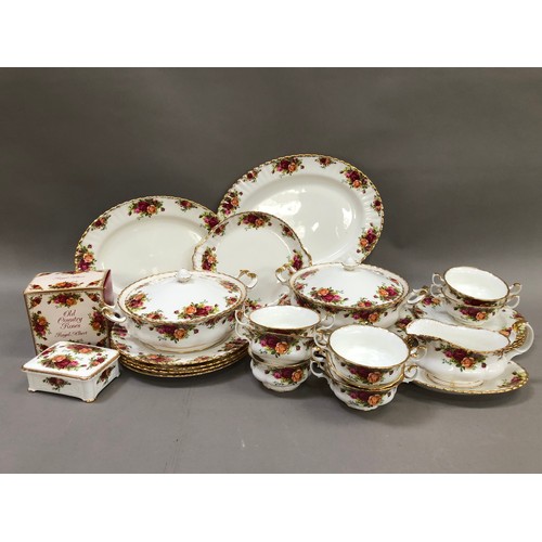 59 - A collection of Royal Albert Country Roses pattern tableware comprising nine dinner plates, two oval... 