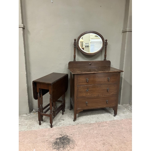 98 - A 20th century oak chest of three drawers with raised back, and oval mirror, 83.5cm wide together wi... 