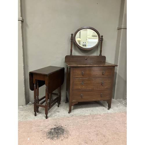 98 - A 20th century oak chest of three drawers with raised back, and oval mirror, 83.5cm wide together wi... 