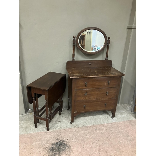 98 - A 20th century oak chest of three drawers with raised back, and oval mirror, 83.5cm wide together wi... 