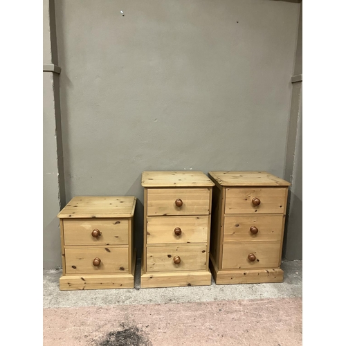 91 - Two pine bedside cabinets of three drawers and a smaller set of two drawers, 50cm wide