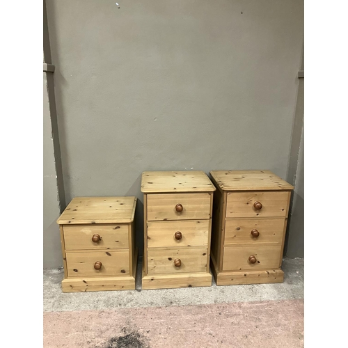 91 - Two pine bedside cabinets of three drawers and a smaller set of two drawers, 50cm wide