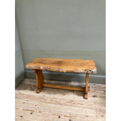 100 - A pine rough hewn bench with single stretcher, 102cm wide