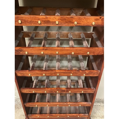 83 - A mahogany wine rack having six tiers with one long drawer