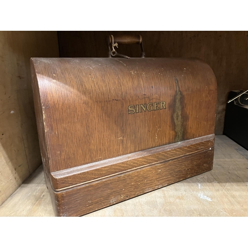 52 - A Singer sewing machine in oak case