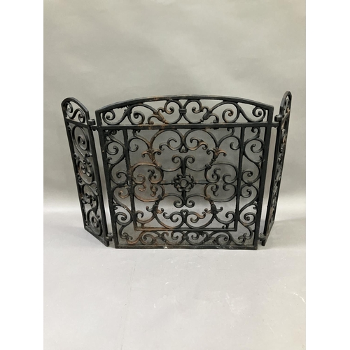 272 - A cast iron fire guard with two hinged sides, 58cm high