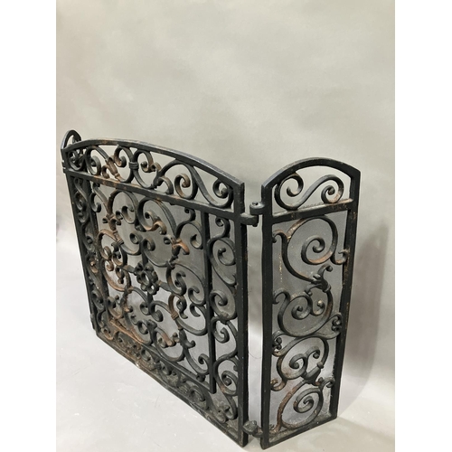 272 - A cast iron fire guard with two hinged sides, 58cm high