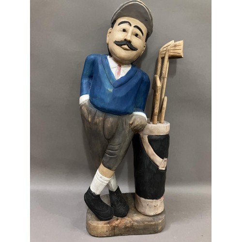 180 - A carved wooden painted figure of a golfer, 78cm high