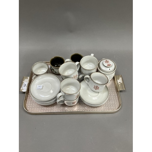 124 - A collection of Denby tea ware comprising eight cups and saucers, sugar bowl , teapot