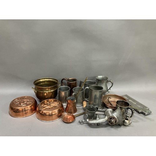 112 - A collection of copper and pewter items including two jelly moulds, a brass and copper twin handled ... 