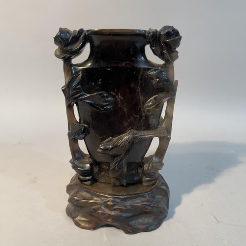 5 - A Chinese dark grey quartz vase carved in relief with flowering branches and bird, 13.5cm high with ... 