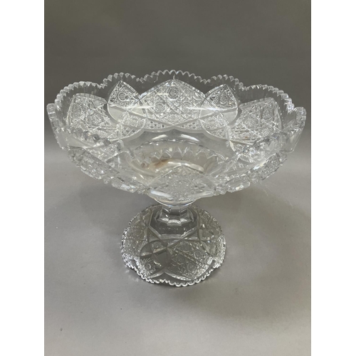 204 - A 19th century glass tazza having wheel cut decoration, on a domed base, 30cm high x 37cm diameter